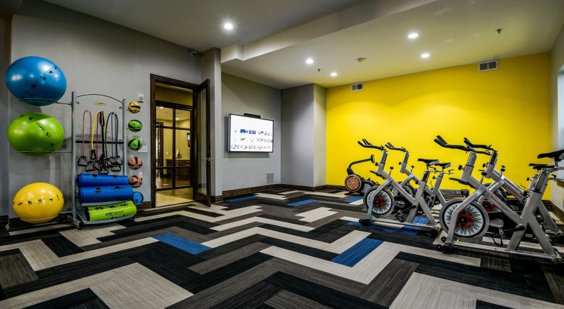 Cutting-edge amenities at your fingertips a cycling room with weighted balls