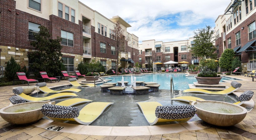 Shimmering resort-style pool a pool with lounge chairs