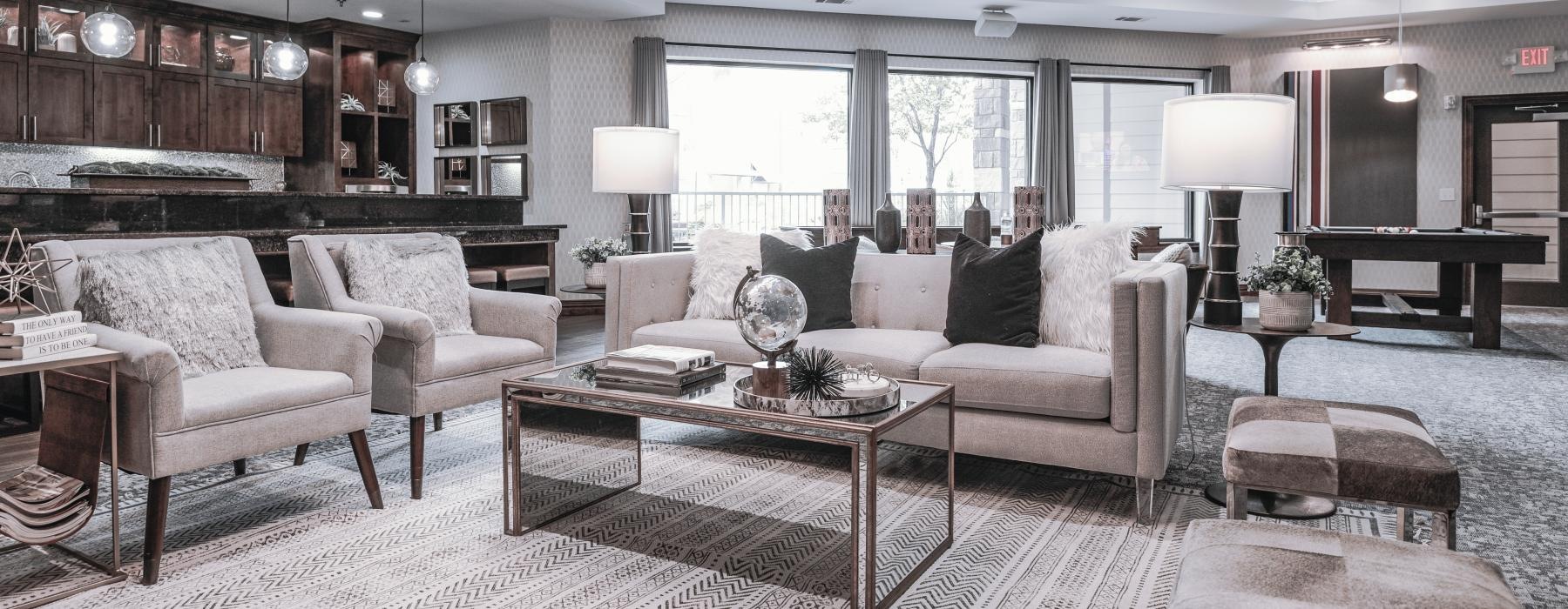 a lobby with a chandelier and a couch