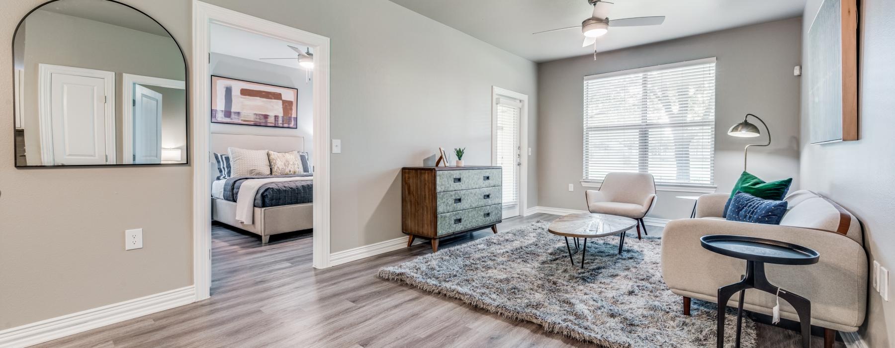 a living room with wood floors