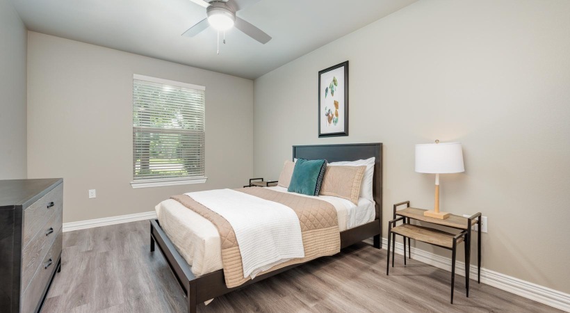 Beautiful bedrooms to fit every need a bedroom with a bed and a lamp